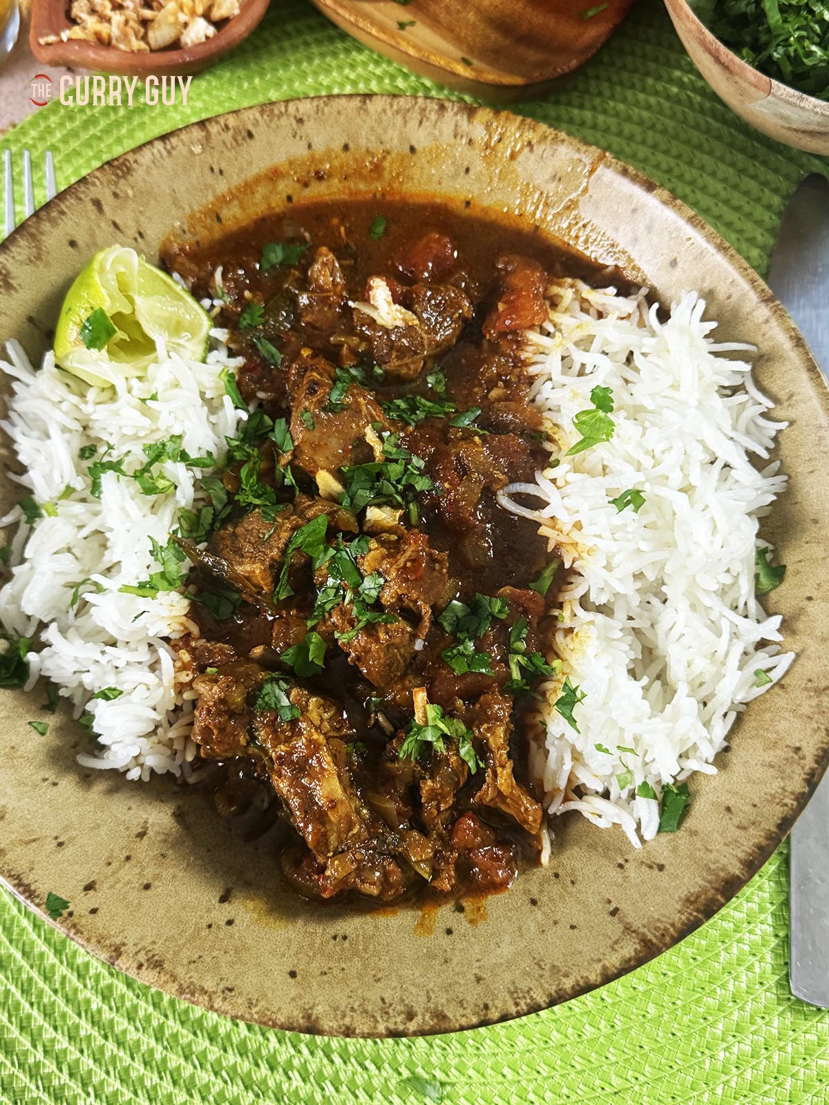 Pork vindaloo served with rice.