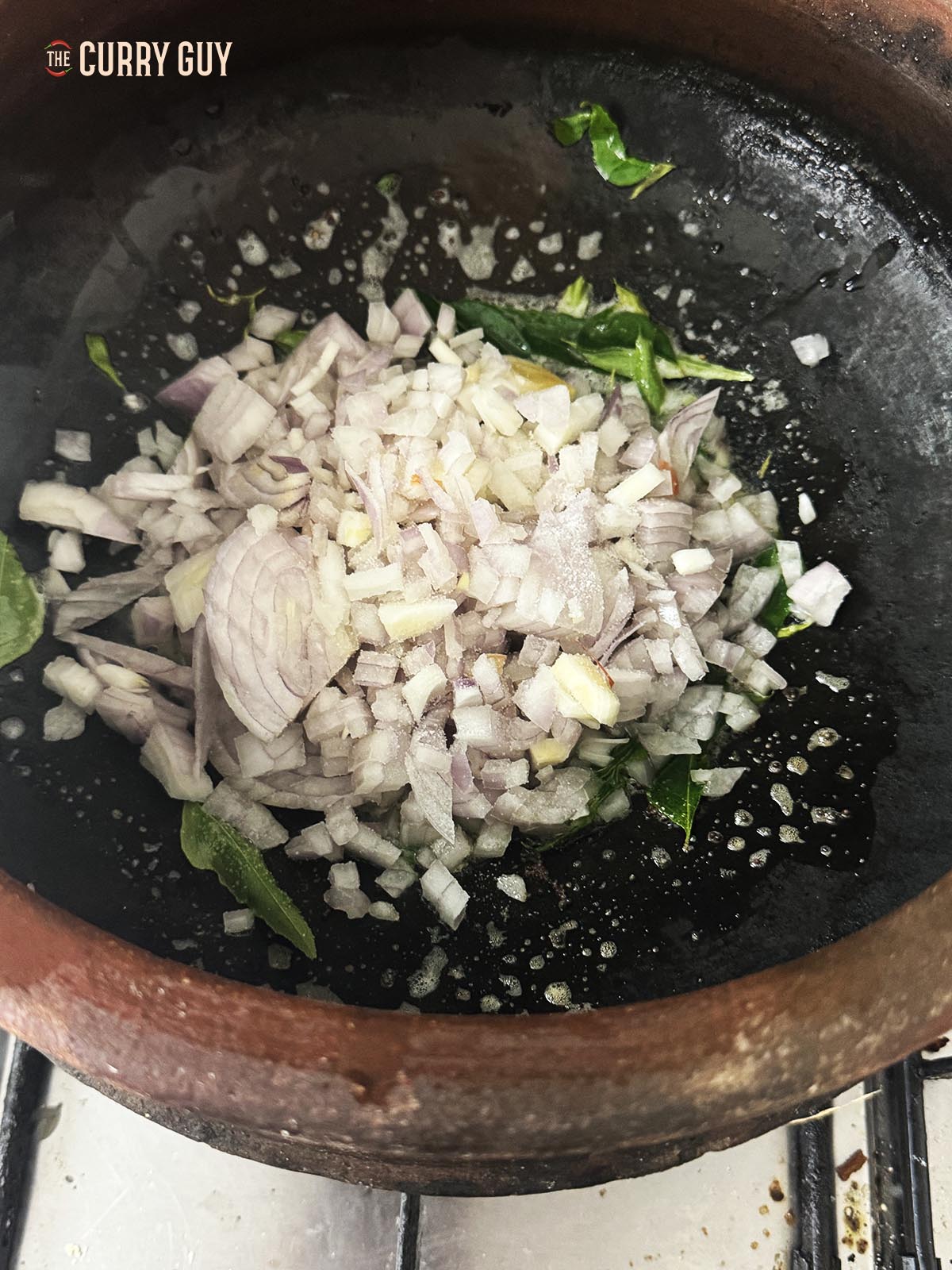 Adding the chopped onions to the pan.