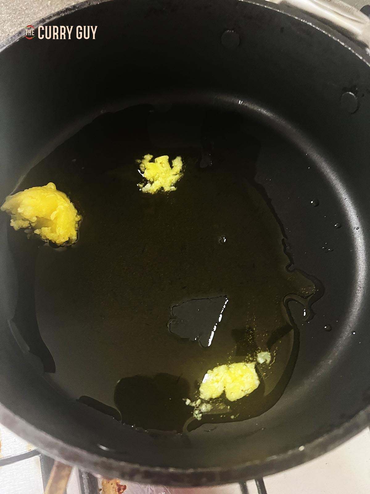Melting ghee in a pan over a medium-high heat.