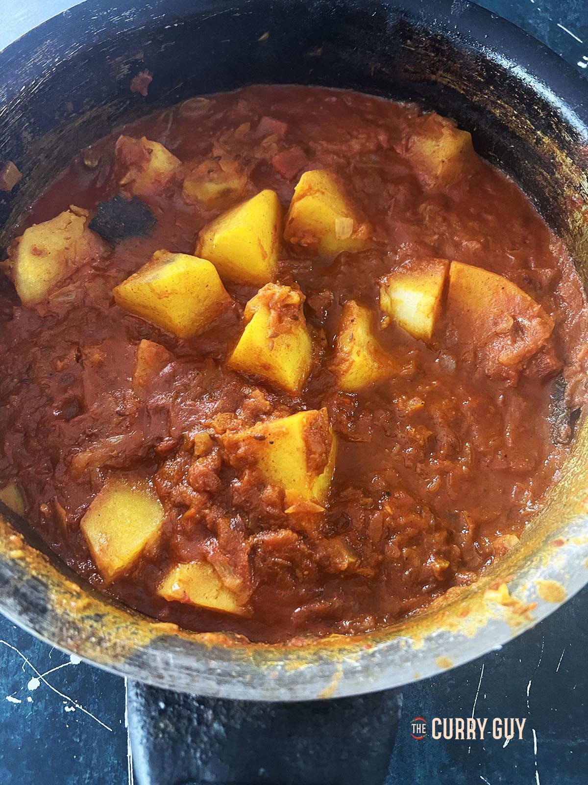 Seasoning the potatoes with salt to taste.