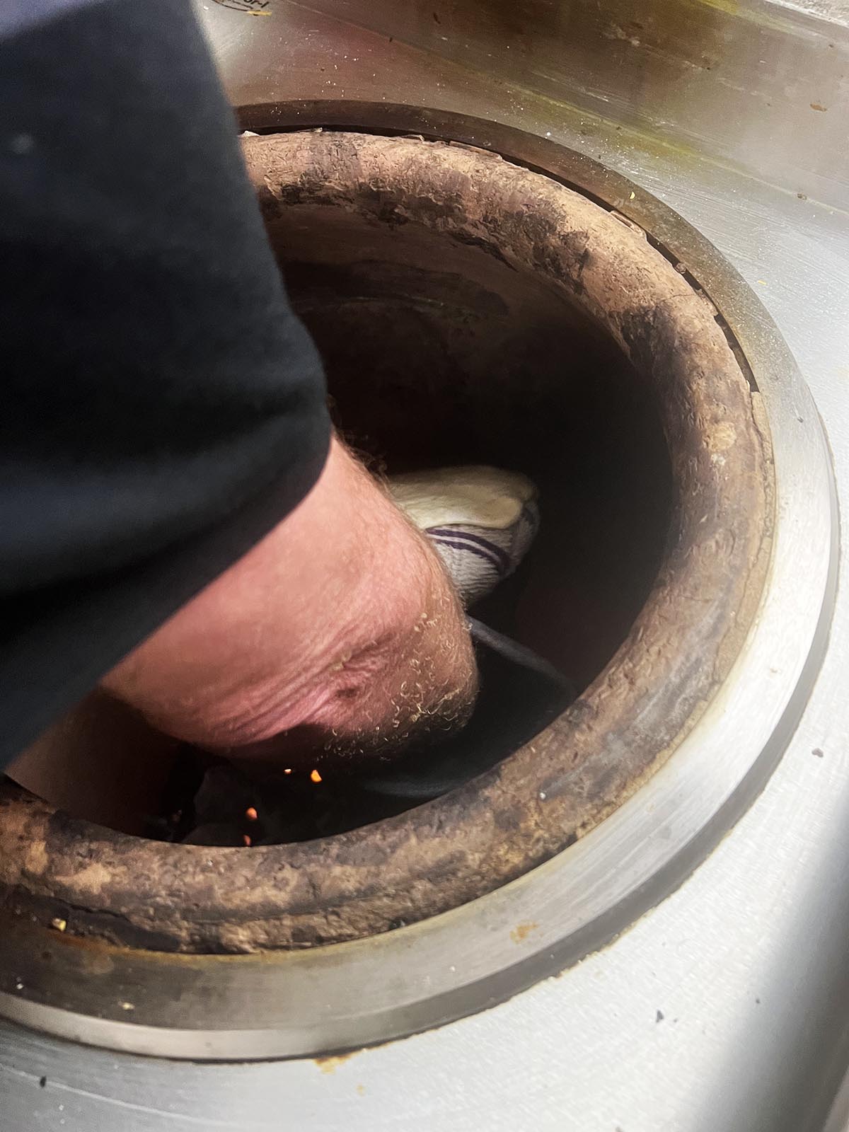 Putting the naan in the tandoor