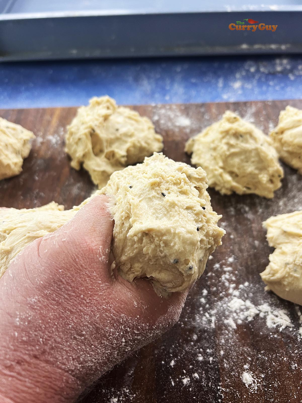 Dividing the naan dough.