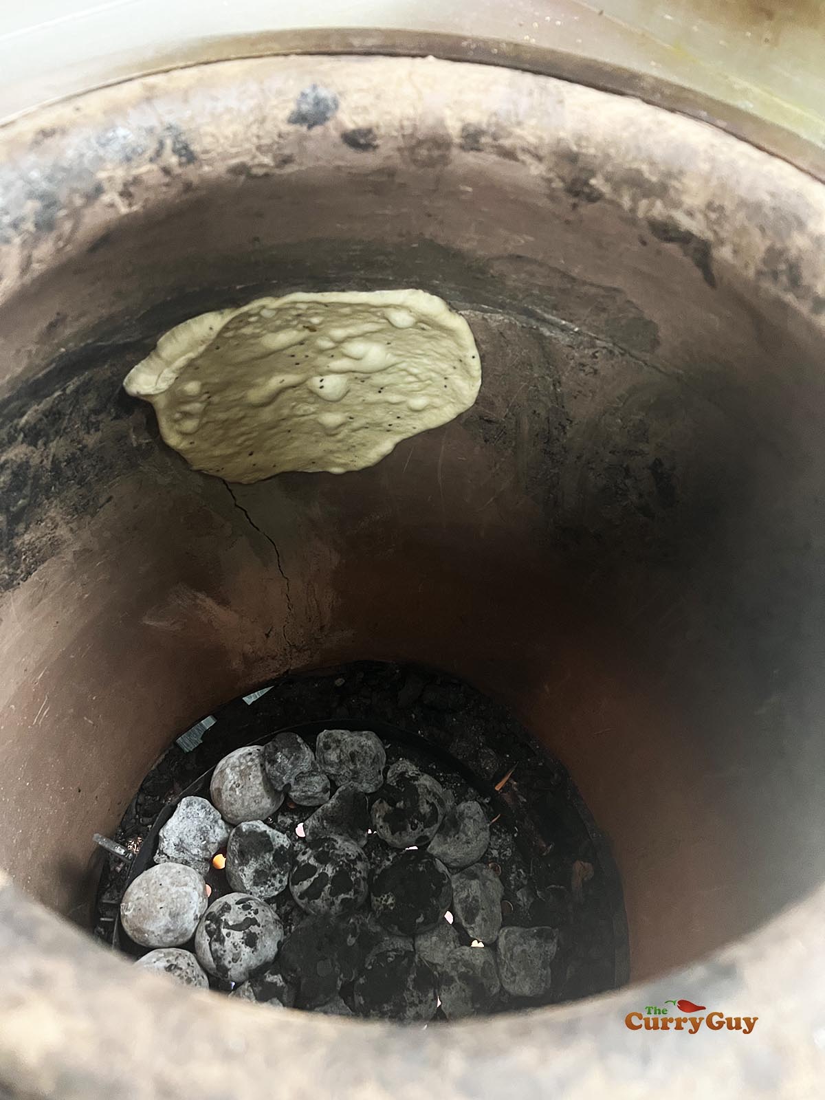 tandoori naan beginning to bubble and cook