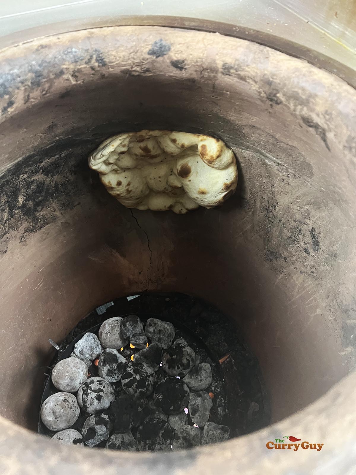 Tandoori naan cooking