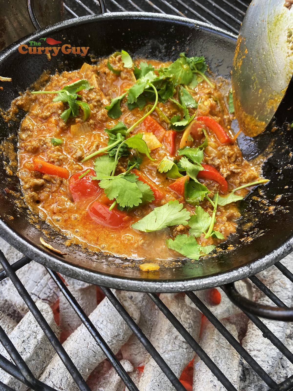 Adding chopped coriander. 