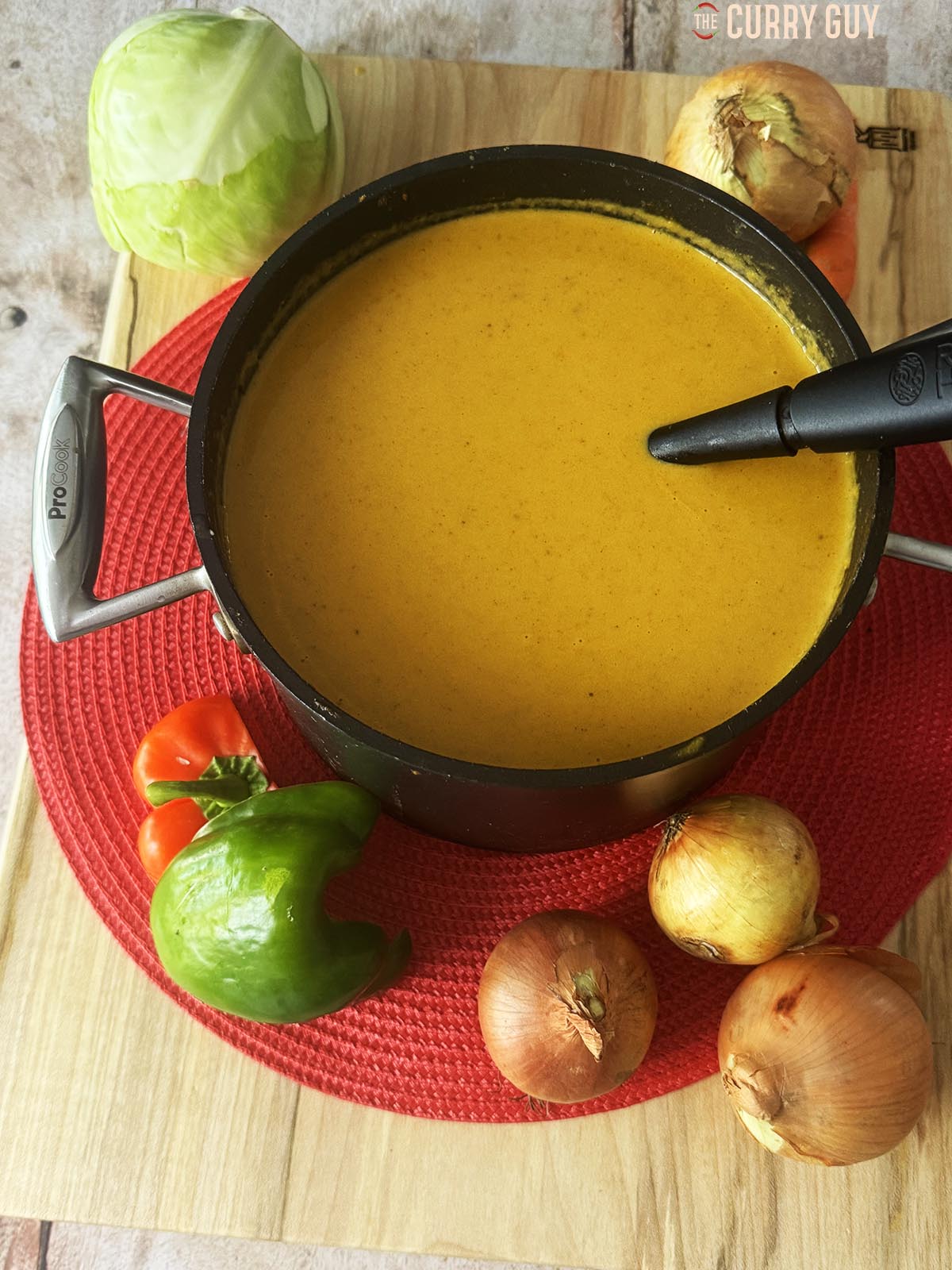 Base curry sauce in a saucepan on a table, ready to use in curry house style curries.
