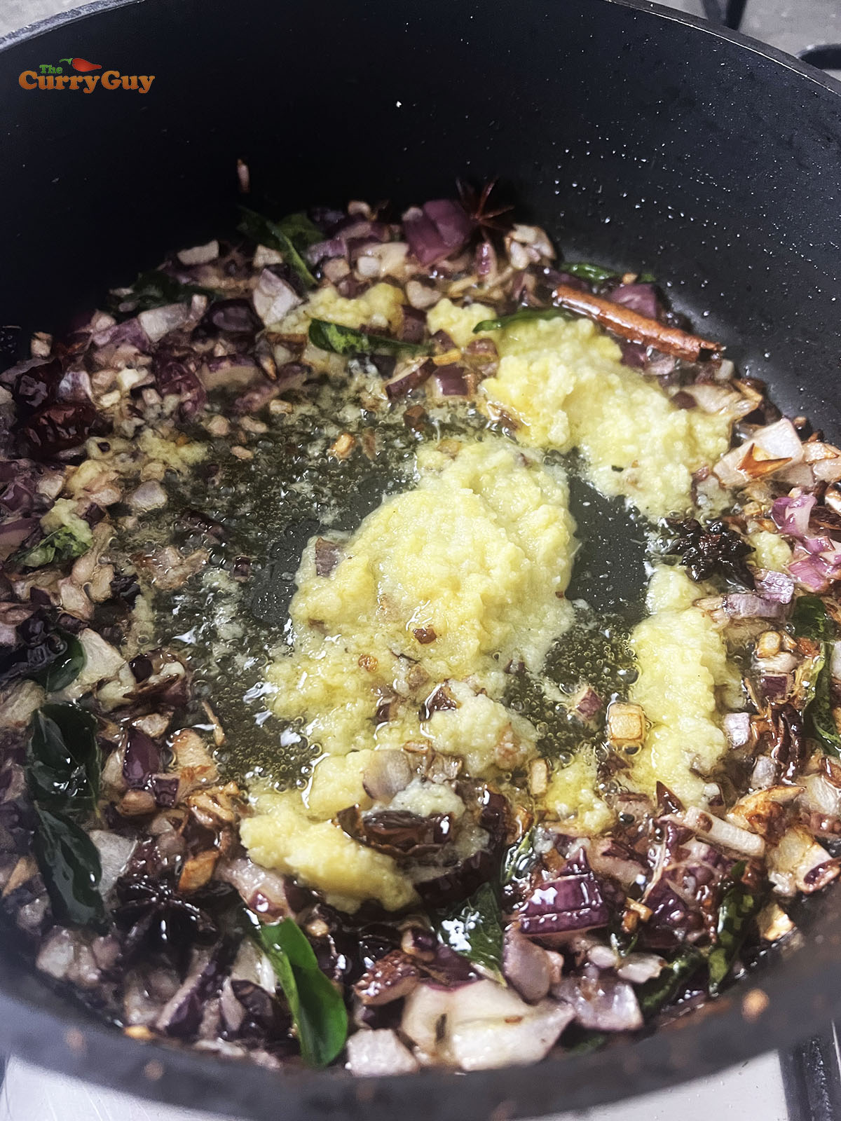 Frying onions and garlic and ginger paste.