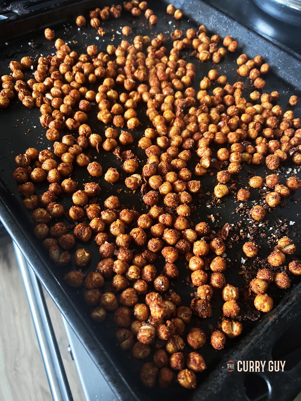 The roasted chickpeas on a baking tray.
