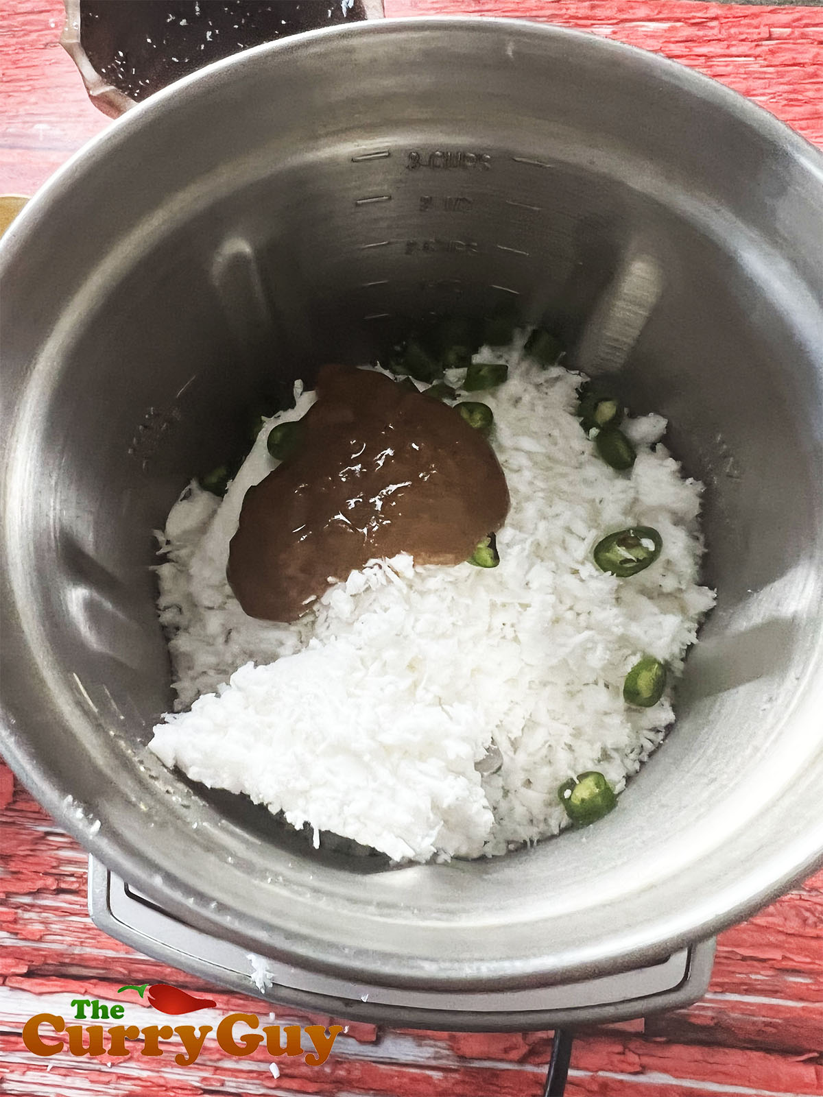 Coconut with chillies and tamarind ready to be blended.