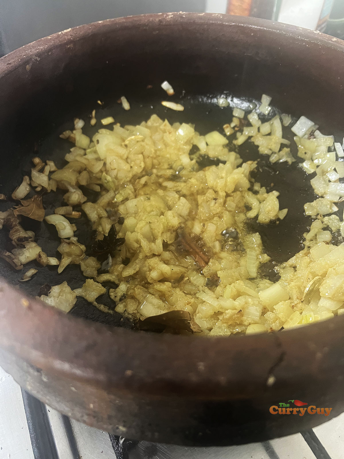 Frying the onions, garlic and ginger.