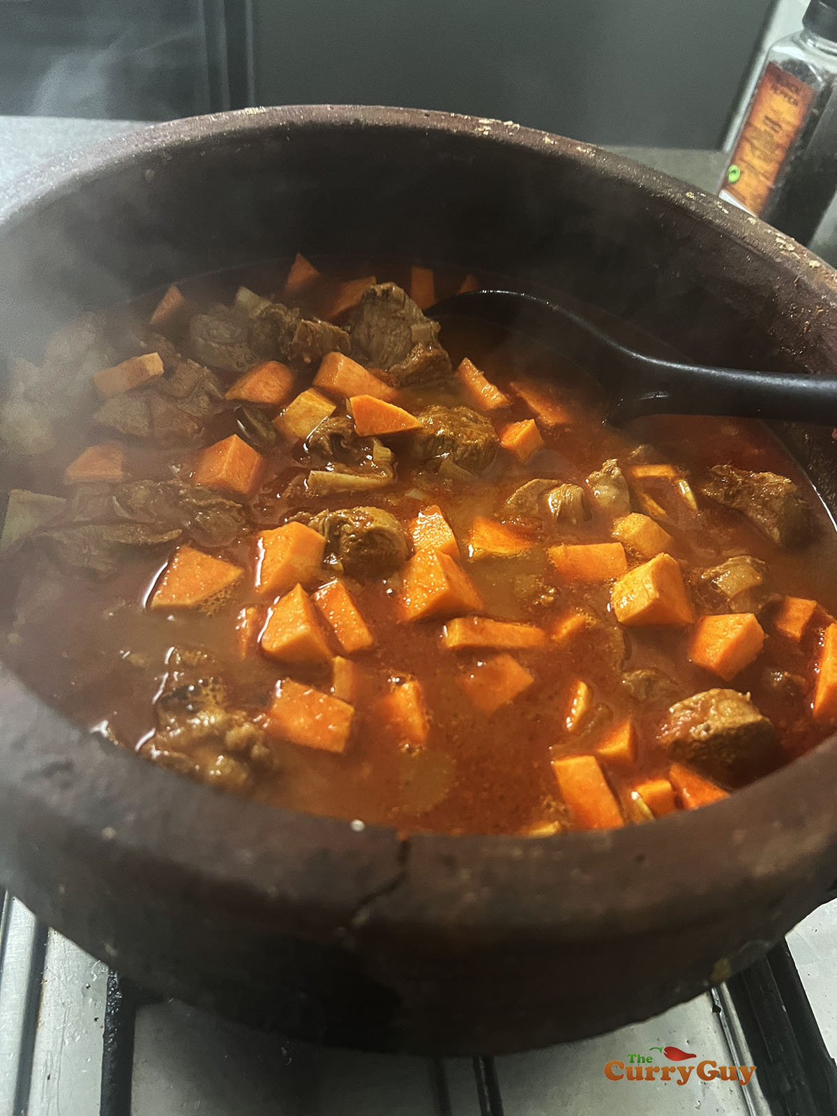 Adding sweet potato chunks.