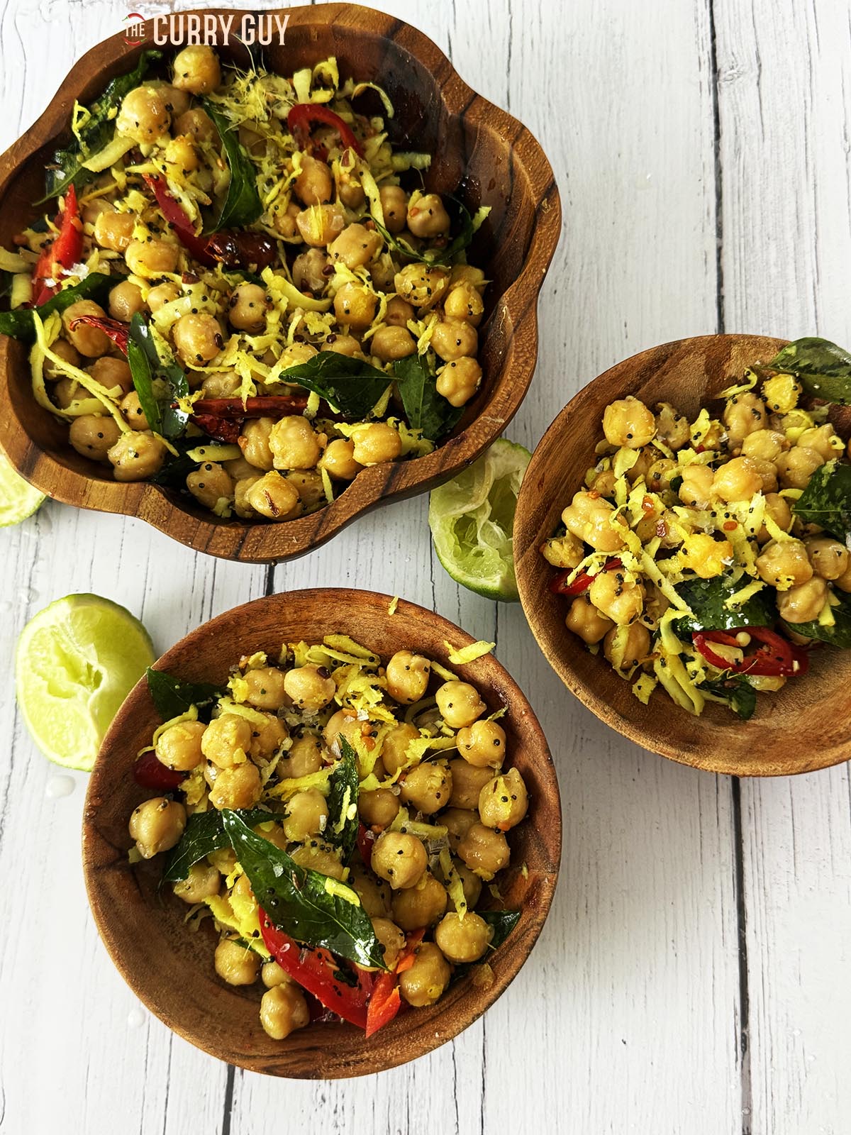 Homemade sundal in wooden serving bowls.