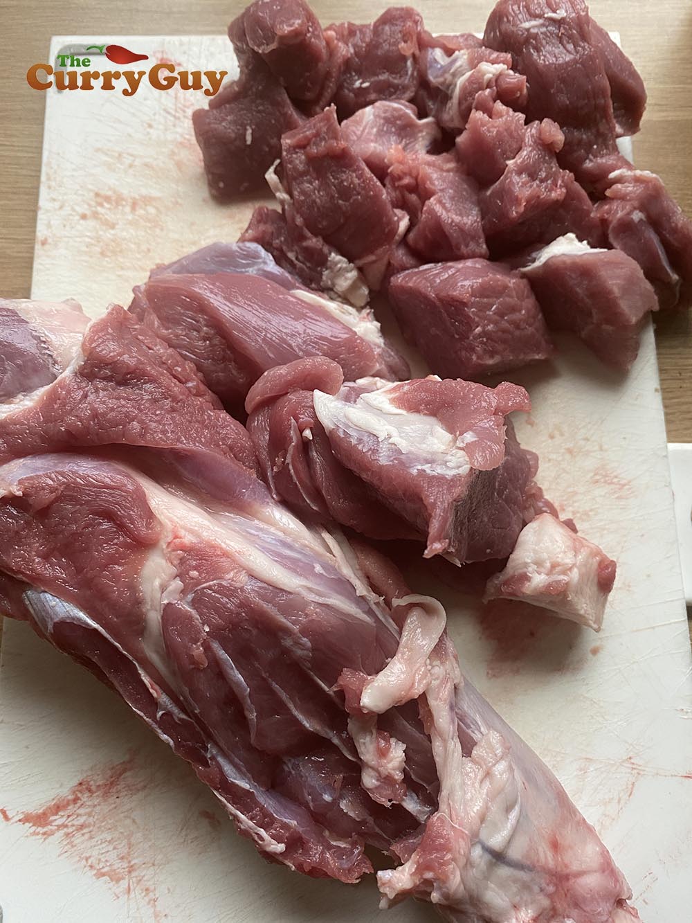 Cutting lamb tikka from lamb leg