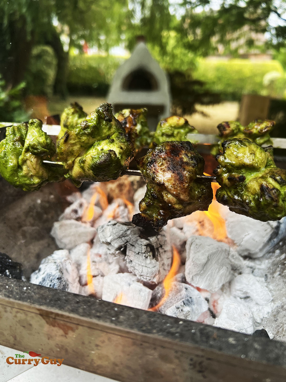 Soola chicken tikka on skewers over the hot coals