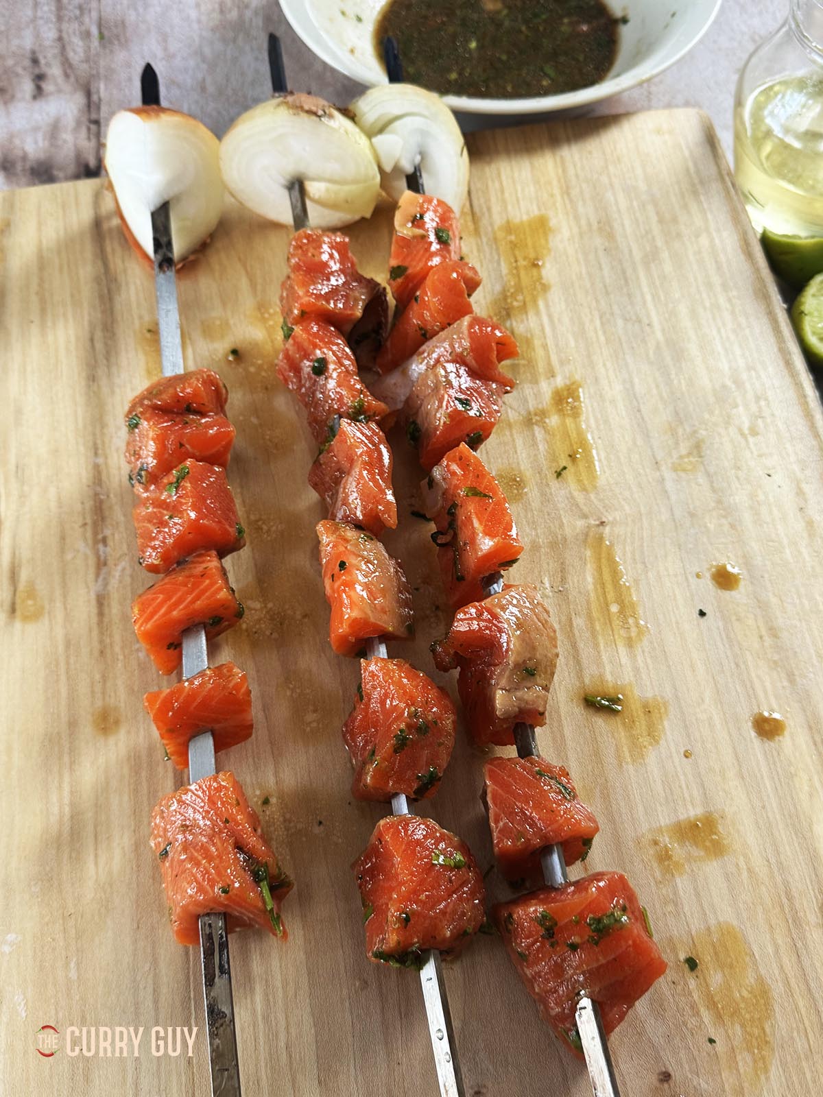 The salmon skewered and ready to cook. 