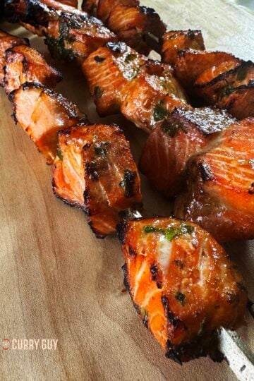 Salmon tikka with soy sauce, garlic and ginger on skewers, ready to serve.