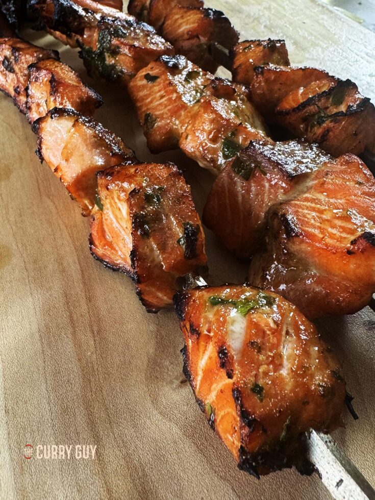 Salmon tikka with soy sauce, garlic and ginger on skewers, ready to serve.