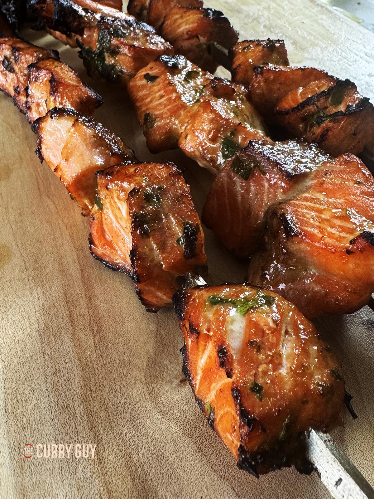 Salmon tikka with soy sauce, garlic and ginger on skewers, ready to serve.