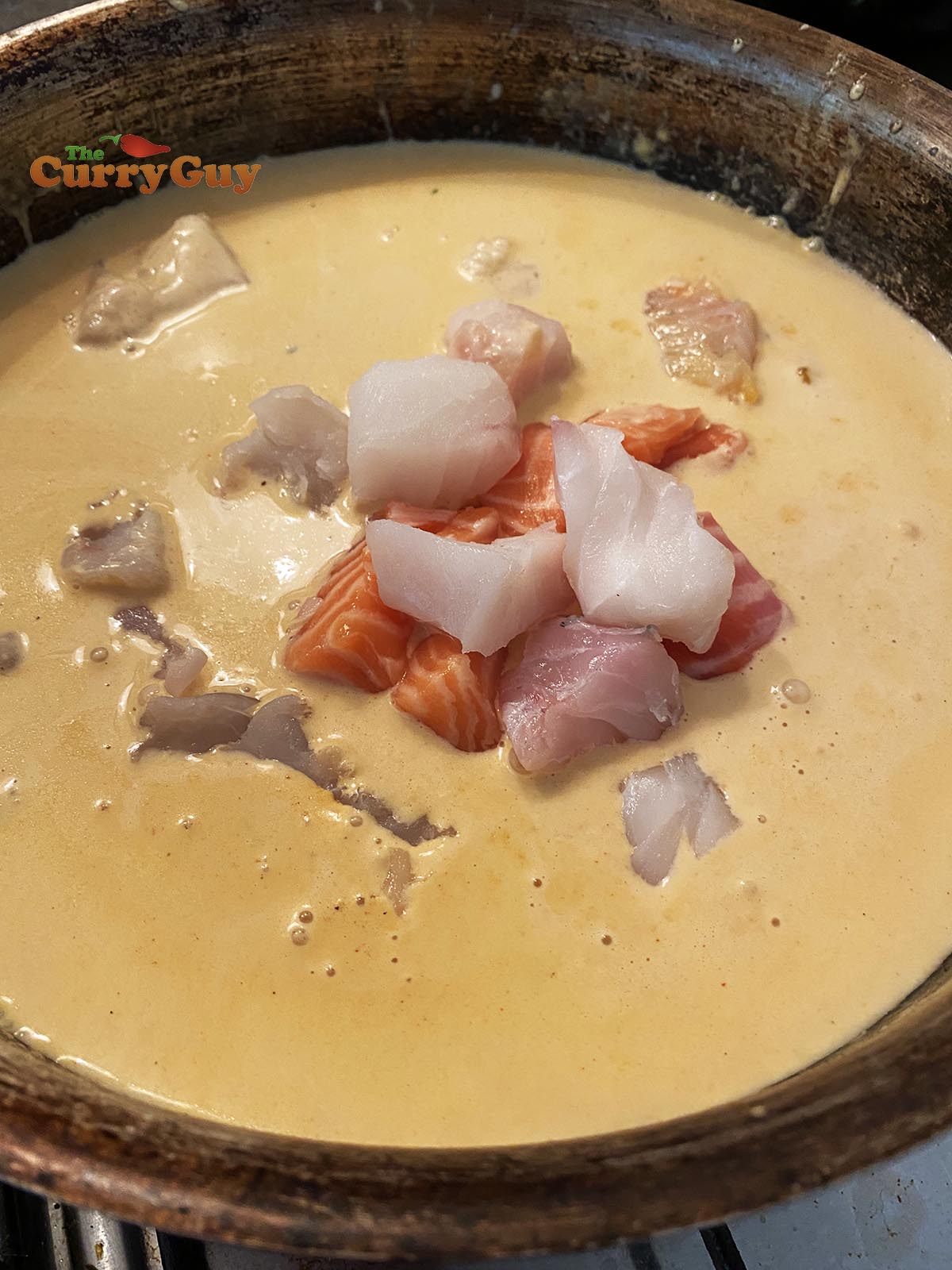 Adding fish to sauce
