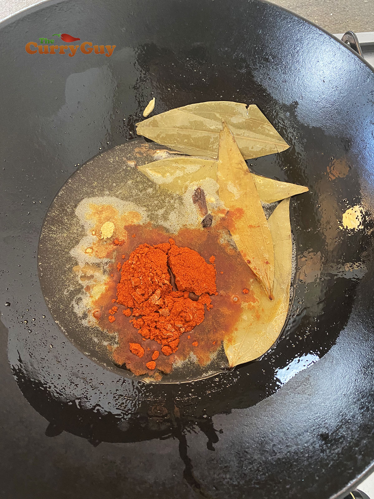 Adding spices to pan