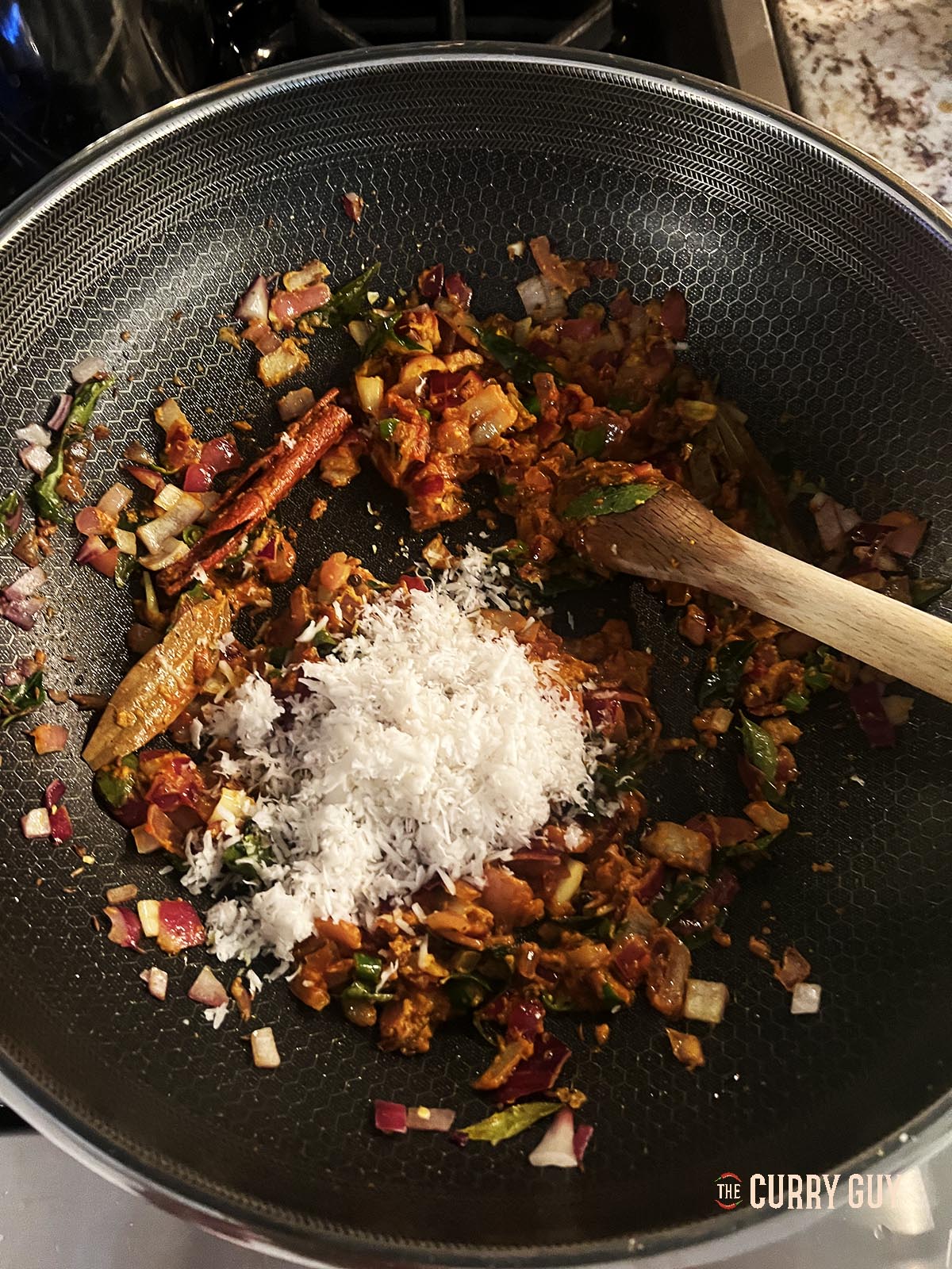 Adding the grated coconut