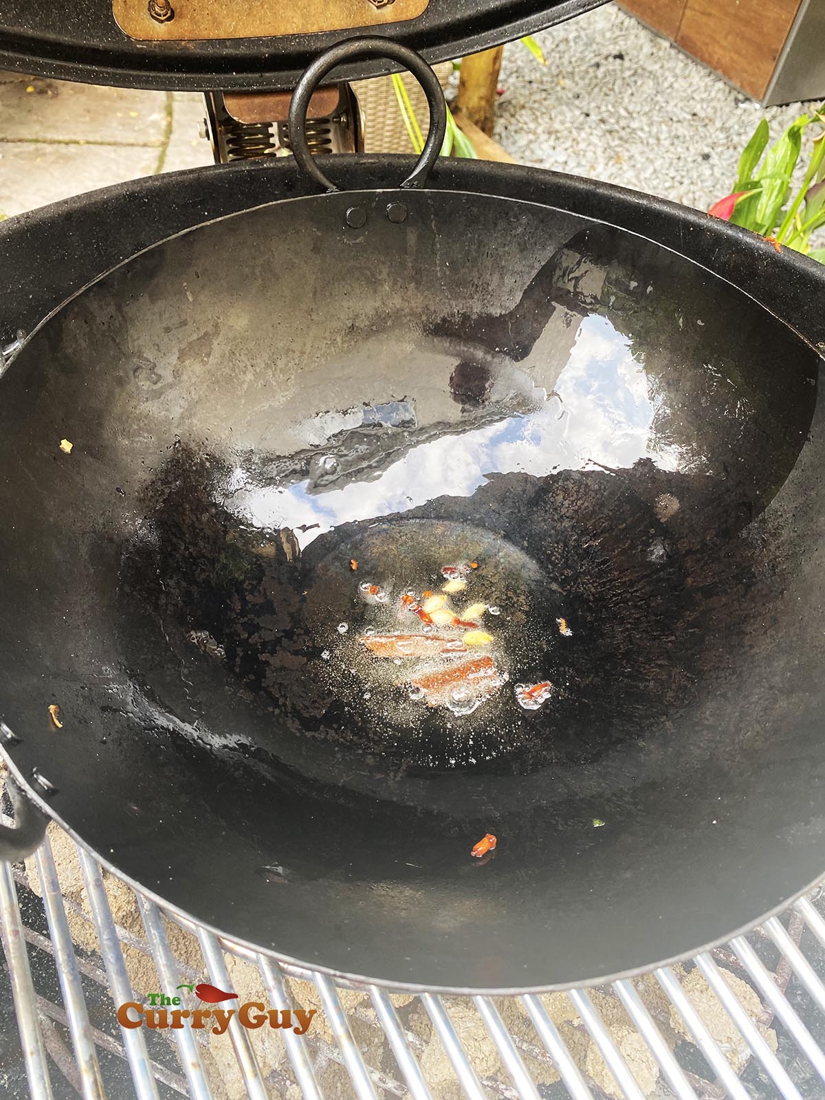 Adding whole spices to hot oil