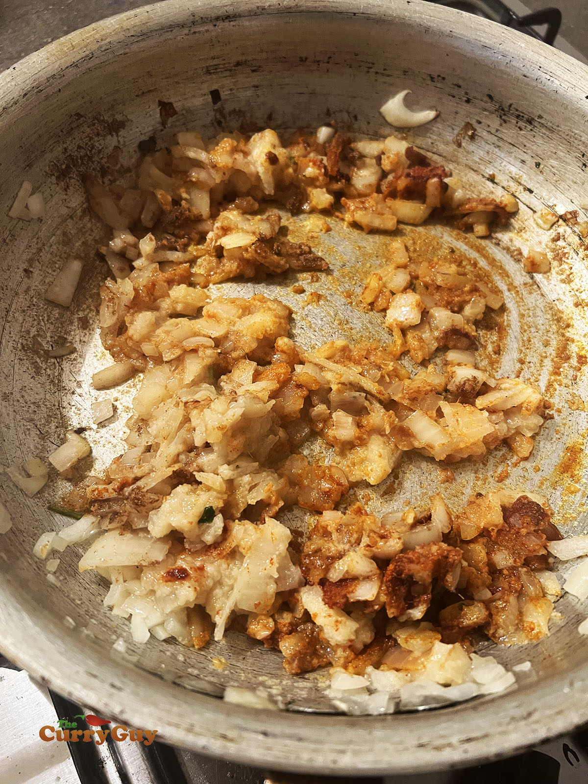 Adding ground spices to the pan