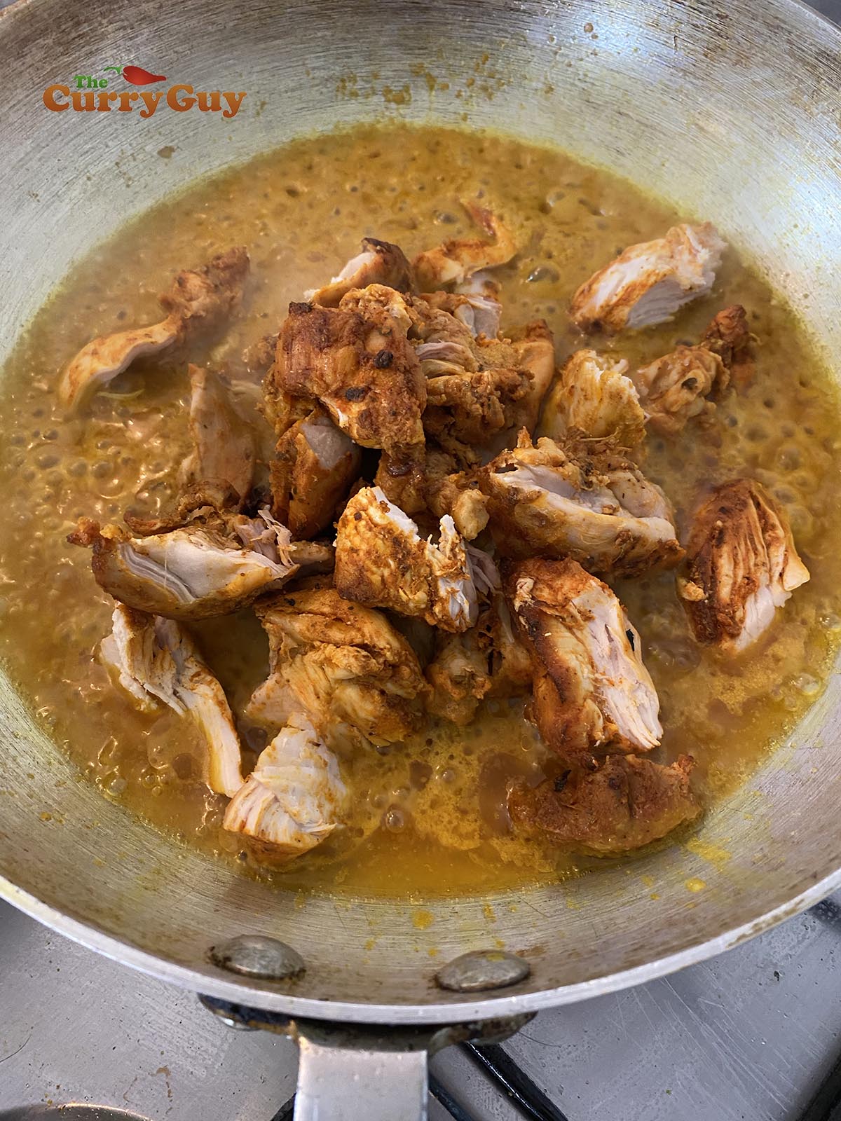 Adding pre-cooked chicken to the pan