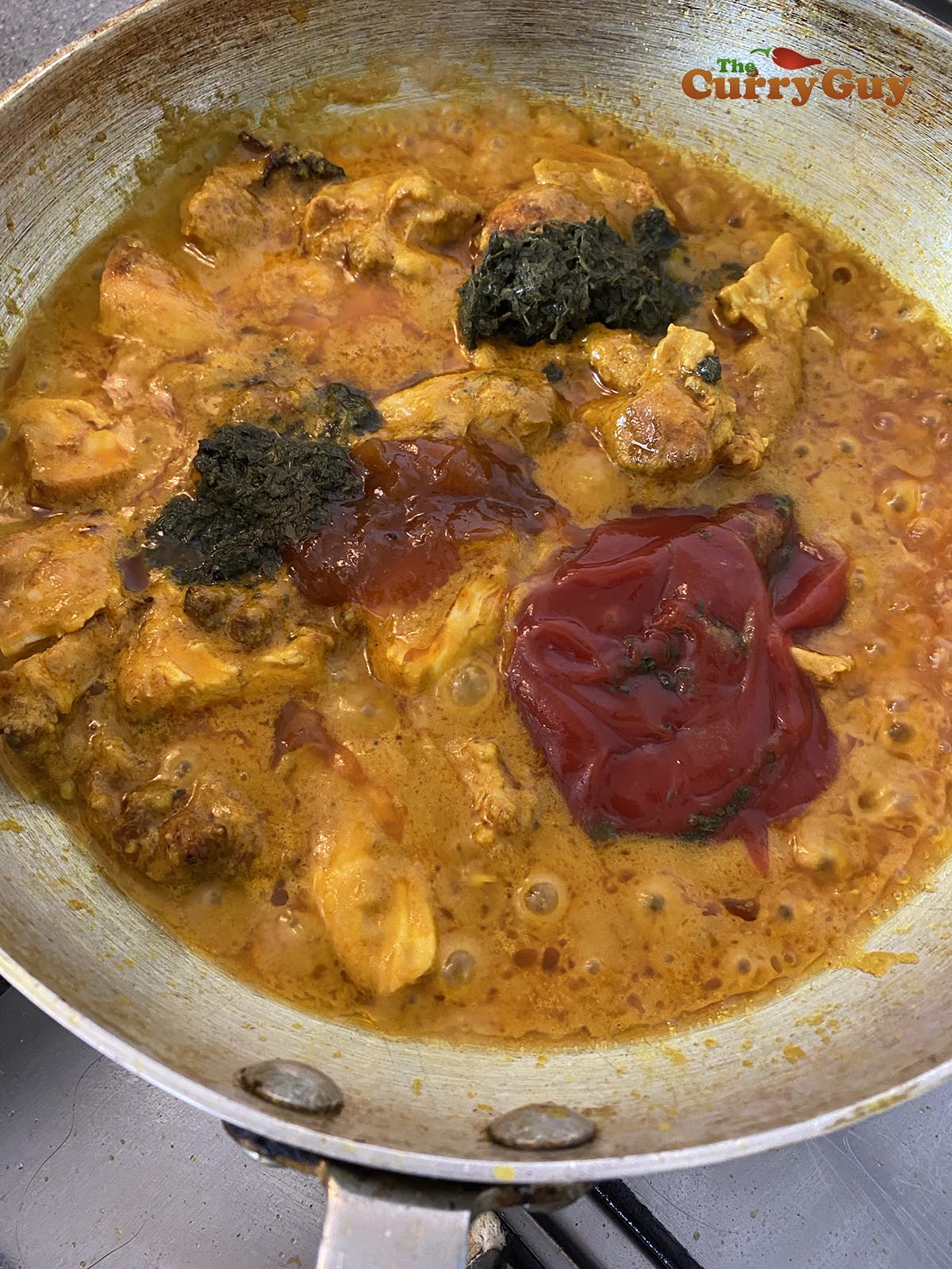 Adding ketchup, mango chutney and mint sauce