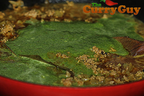 Adding spinach blend to lamb keema saag curry