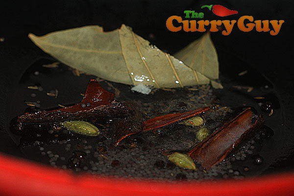 Frying whole spices in oil for lamb keema saag