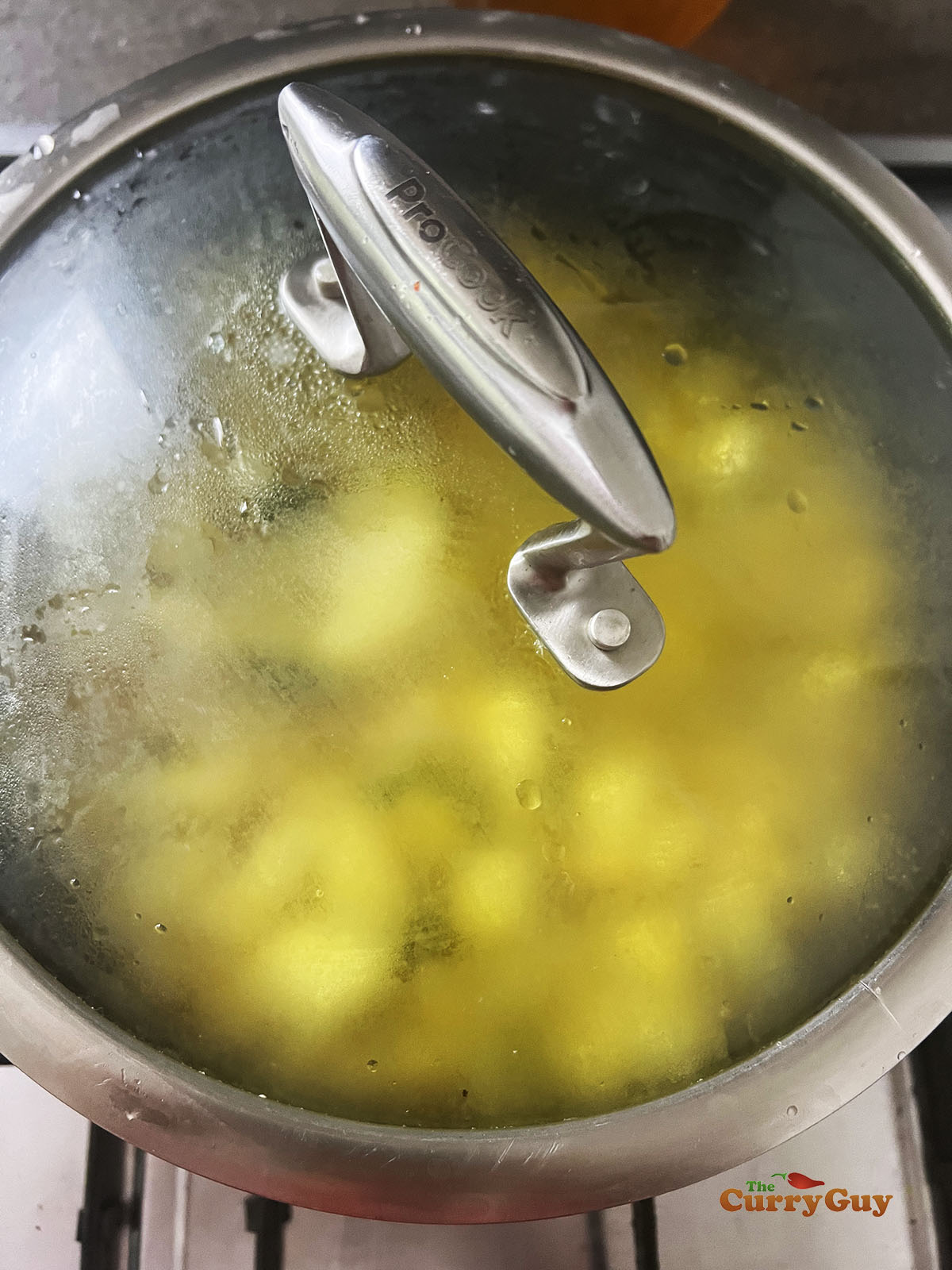 Simmering the cubed potatoes.