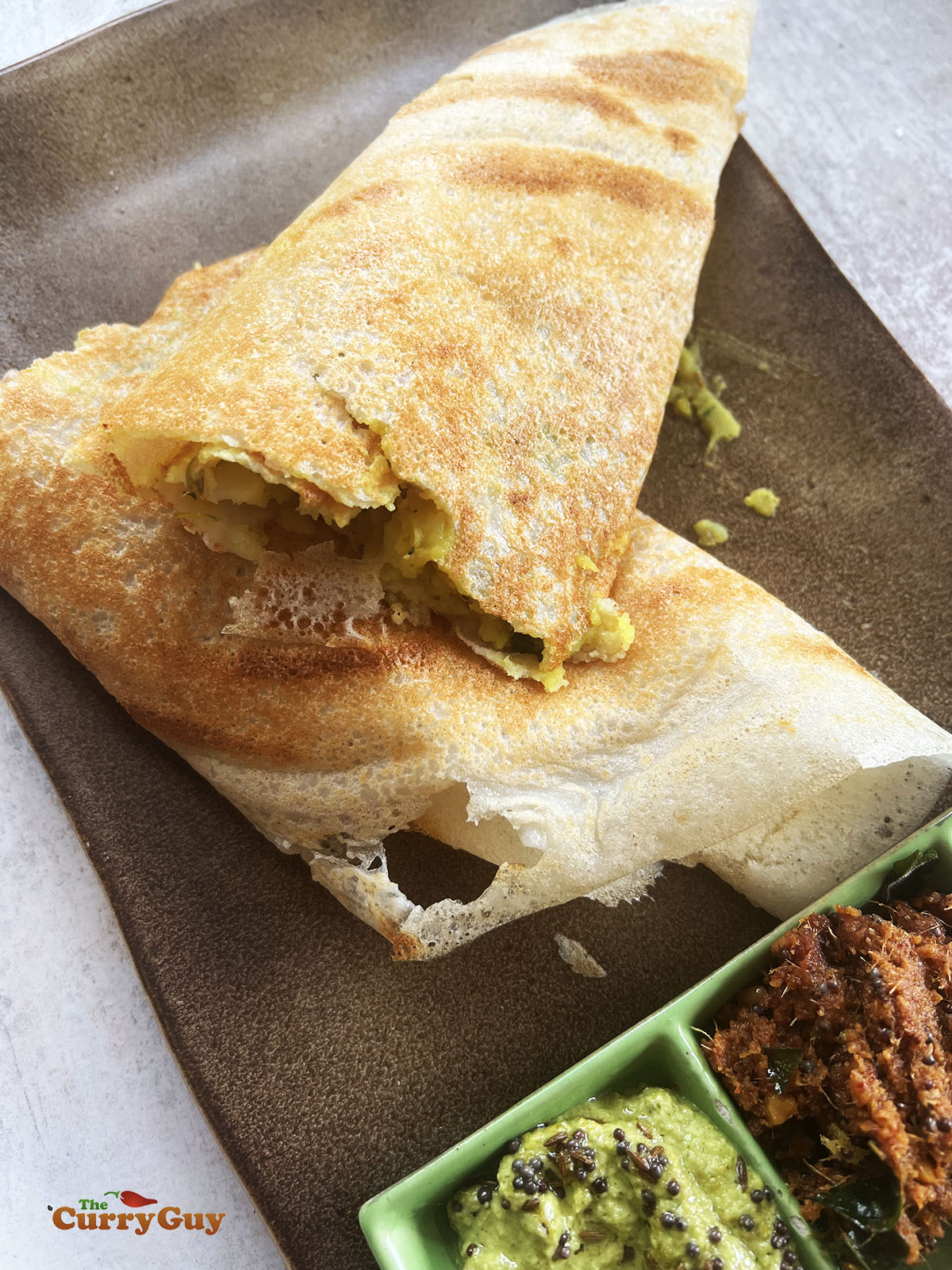 The masala dosa cut in half.