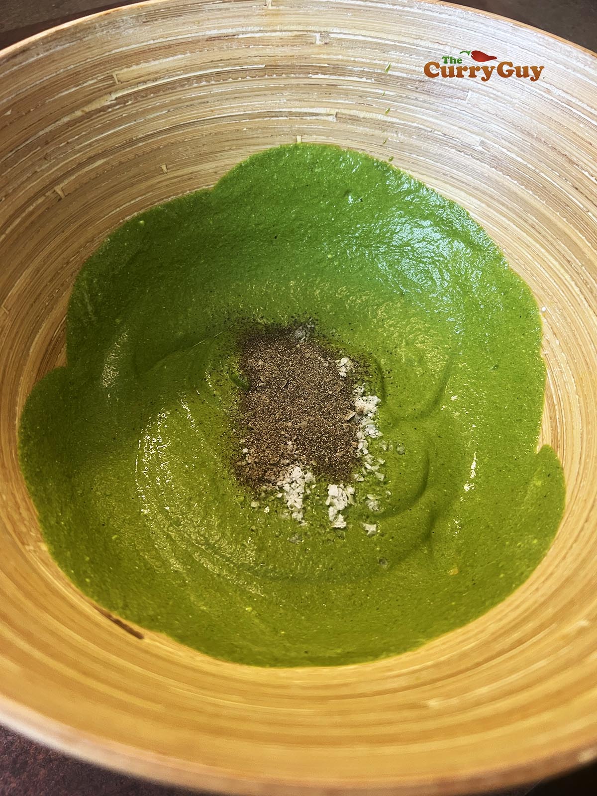 Seasoning the marinade with salt, pepper and garam masala