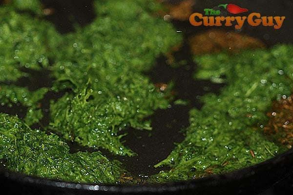 The fenugreek leaves added to the mustard oil.