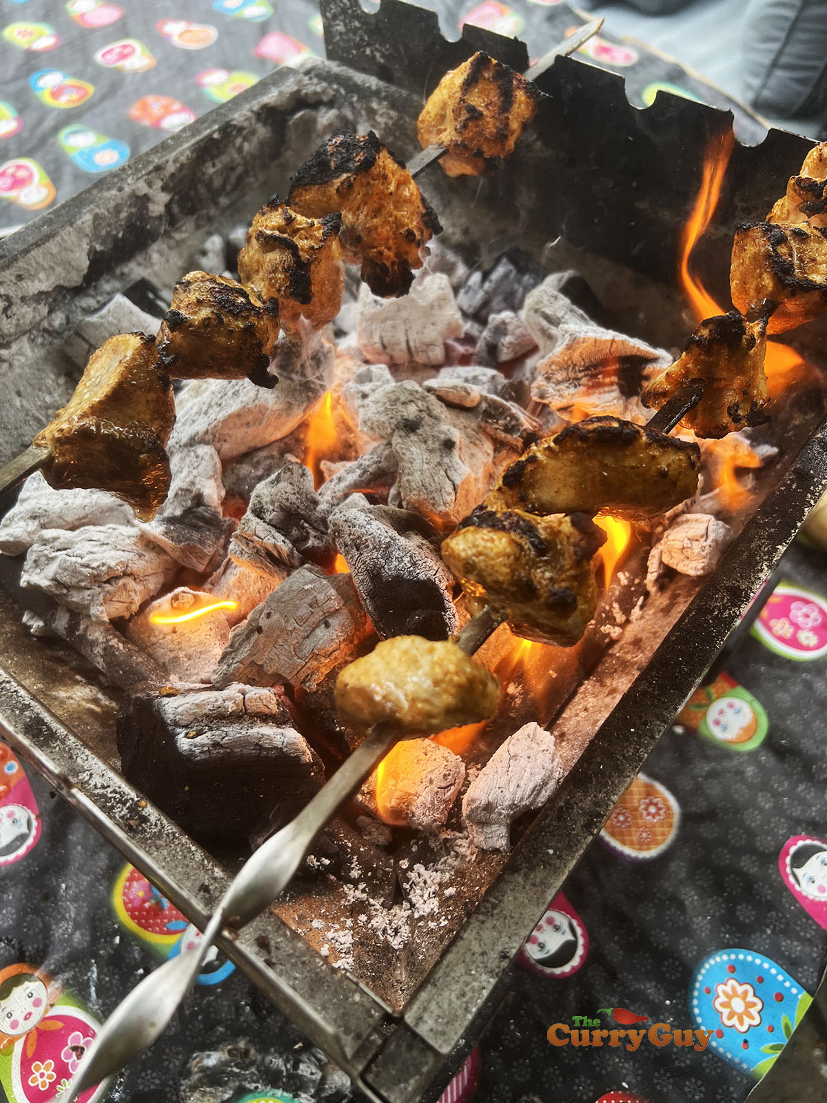 Grilling chicken over the fire