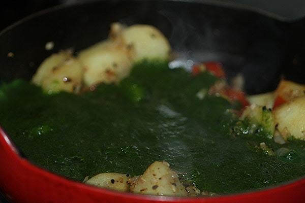 Making saag aloo