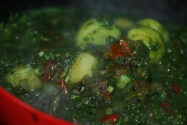 Making saag aloo.