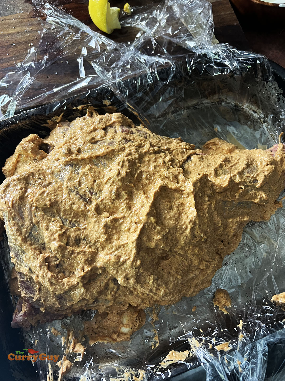 Marinating the leg of lamb.