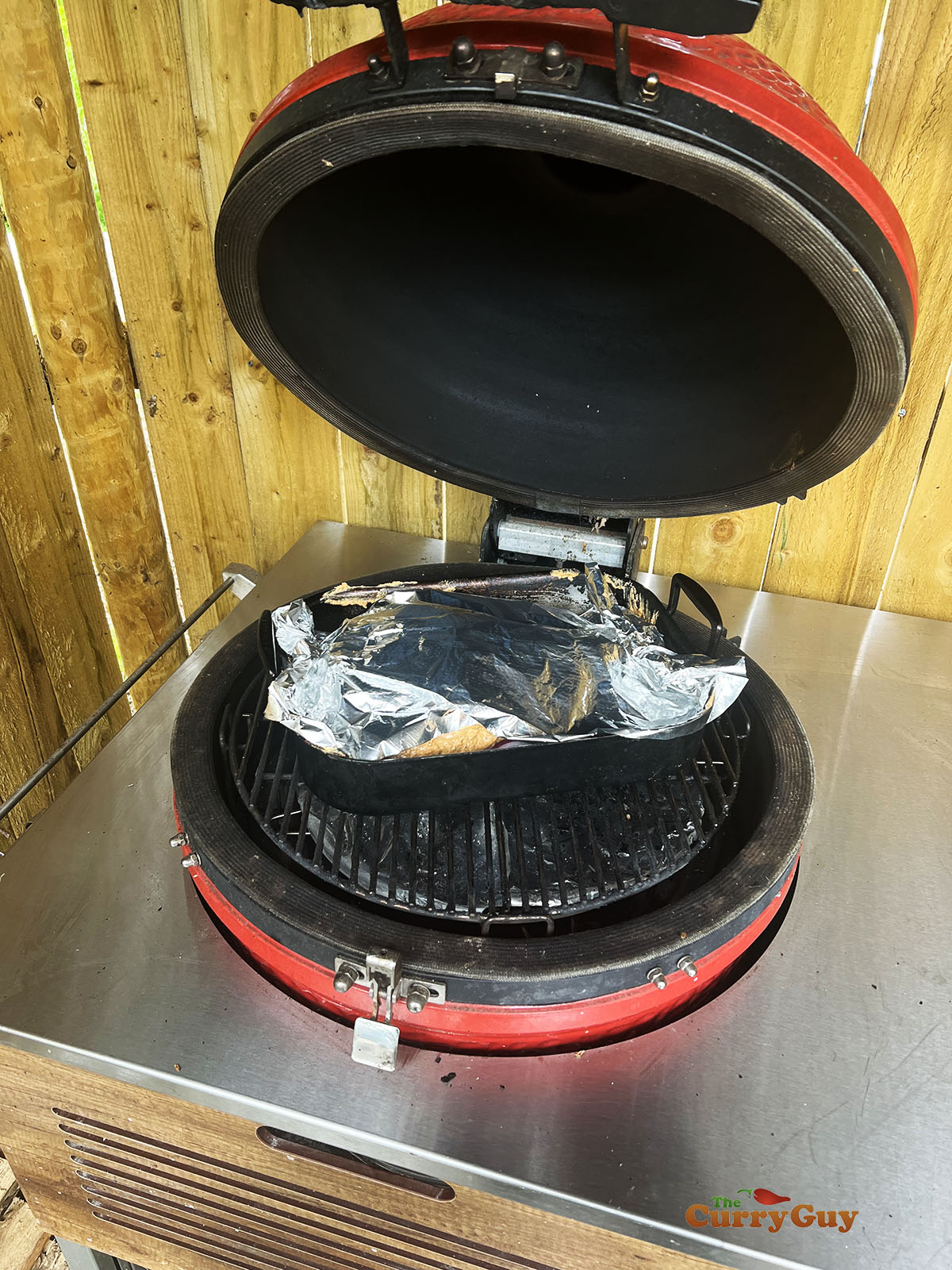 Lamb raan covered with foil for cooking.