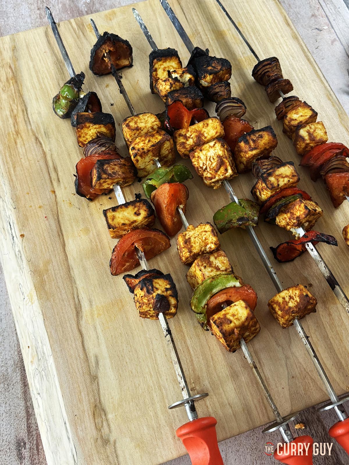 The tandoor paneer tikka on a countertop ready to serve.