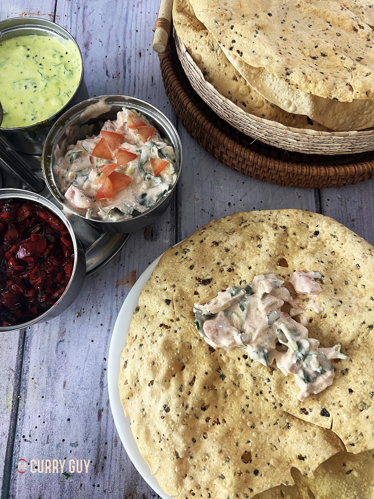 tomato raita on a poppadom.