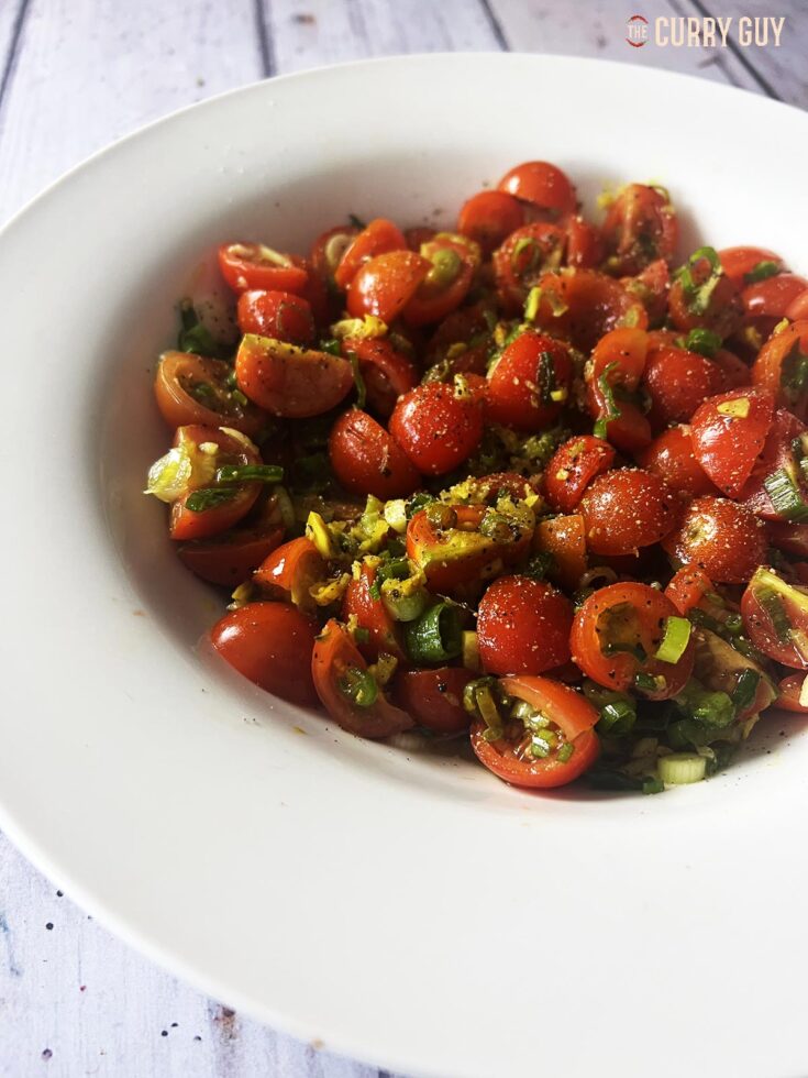 The finished turmeric tomatoes seasoned with salt and pepper.