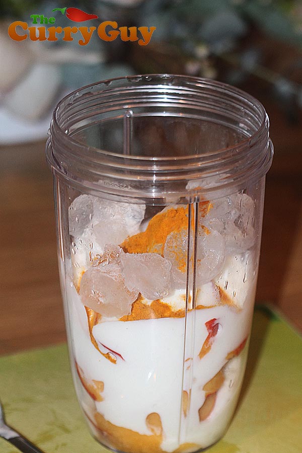 Making nectarine and turmeric lassi