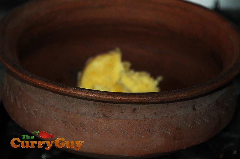 Making black chicken curry