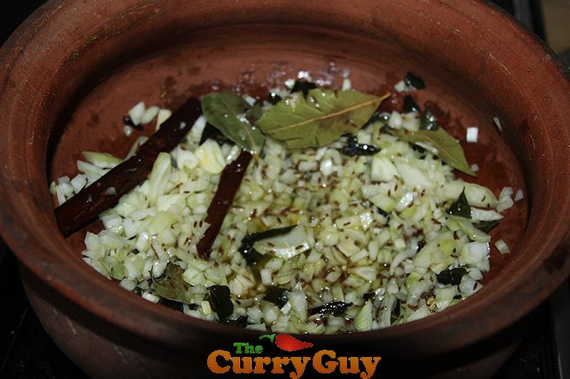 Making black chicken curry