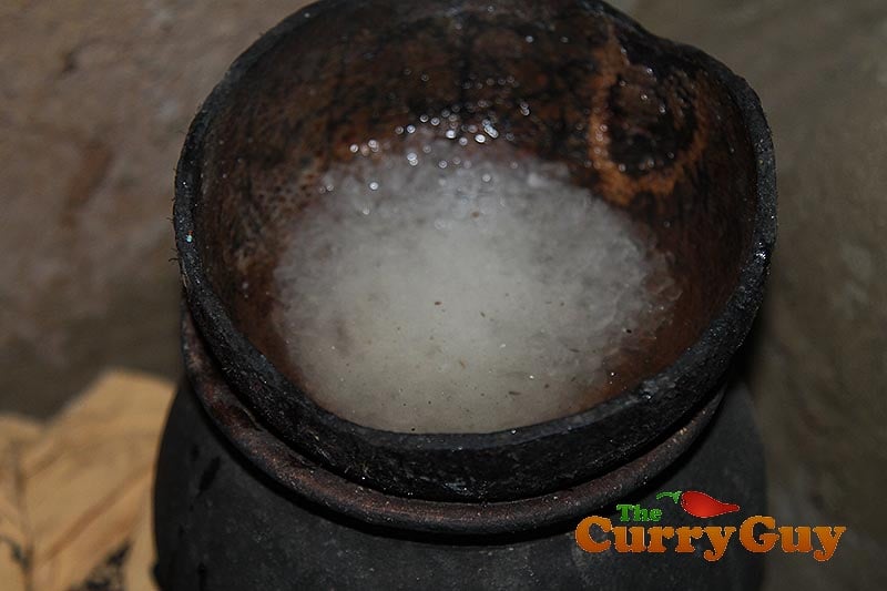 Making coconut, chilli and onion chutney