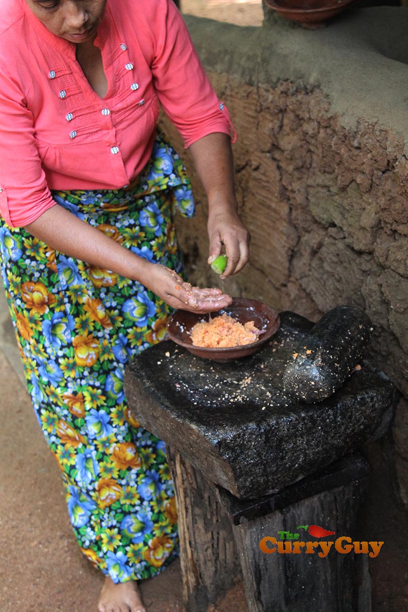 Making coconut, chilli and onion chutney