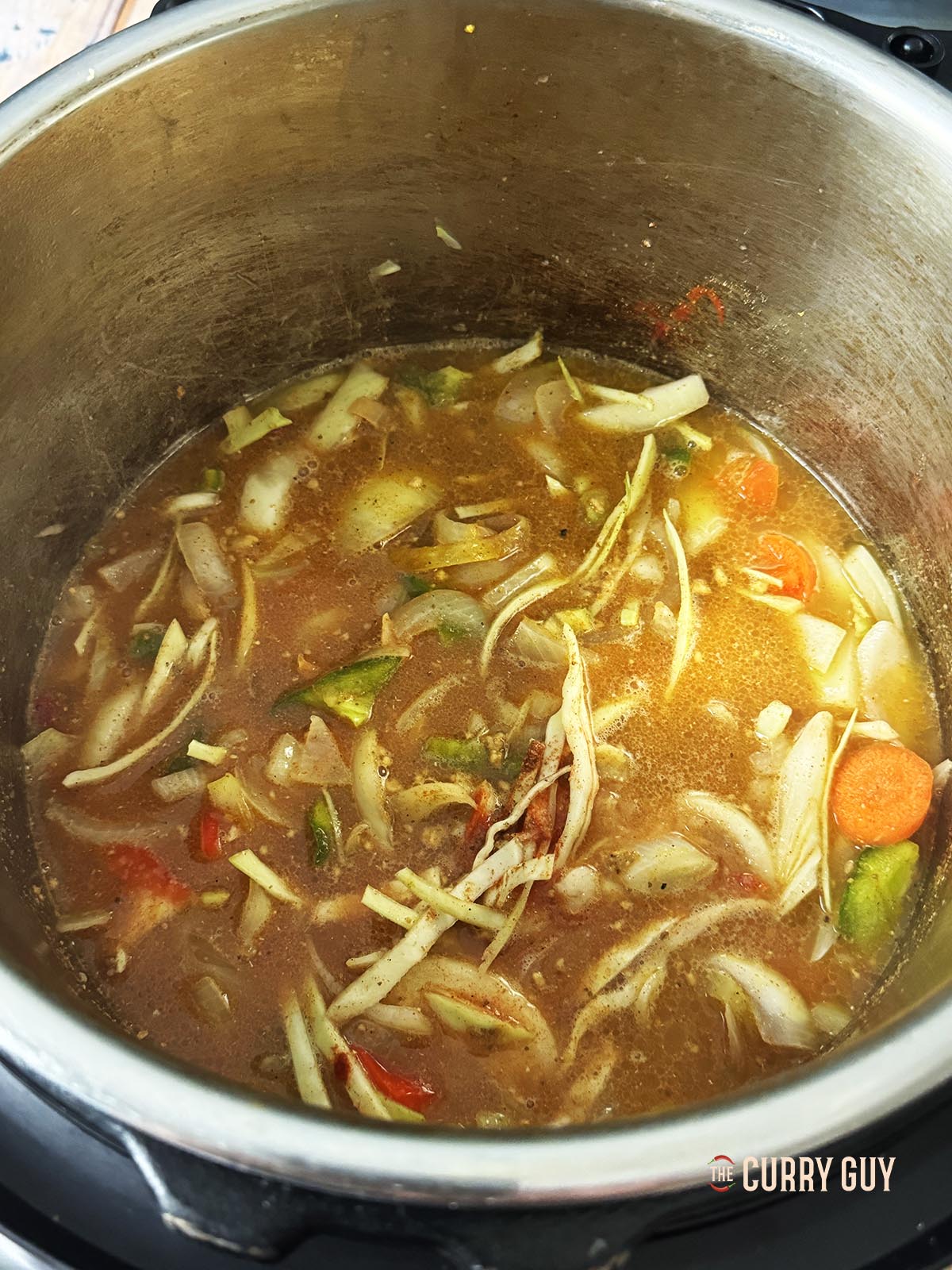 The ingredients in the multi cooker ready to be pressure cooked.