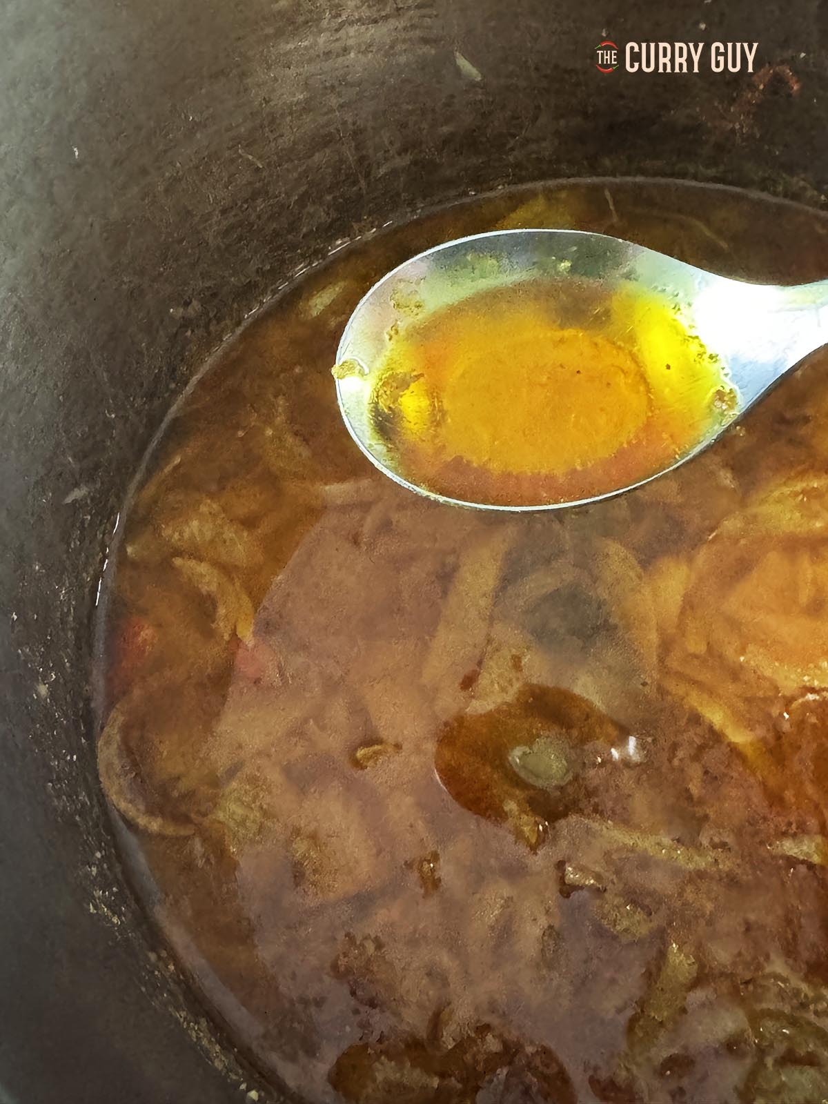 A spoonful of the oil from the sauce.